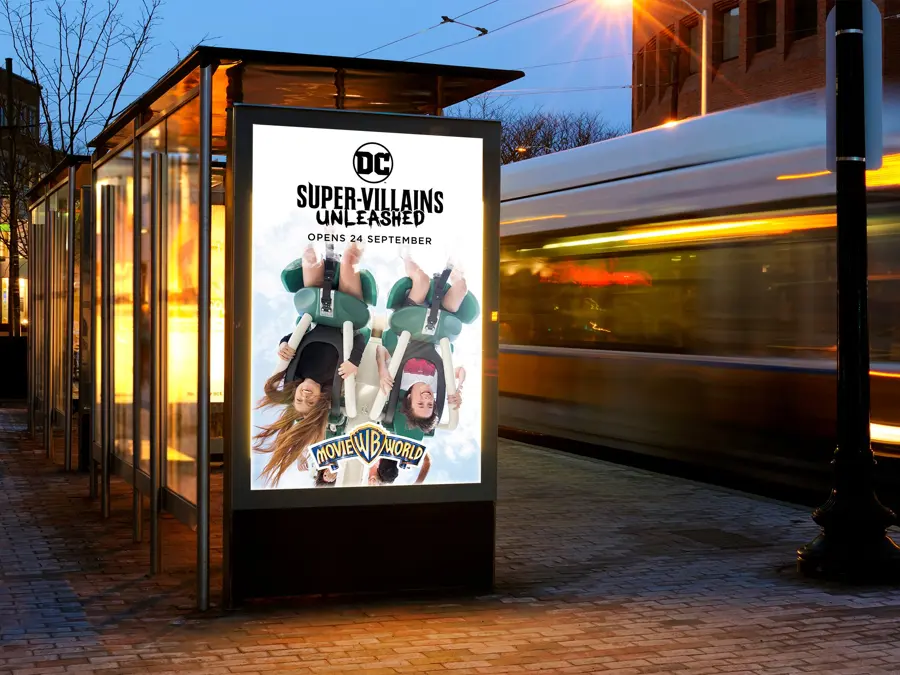 A night time bus shelter poster for DC Super Villains Unleashed