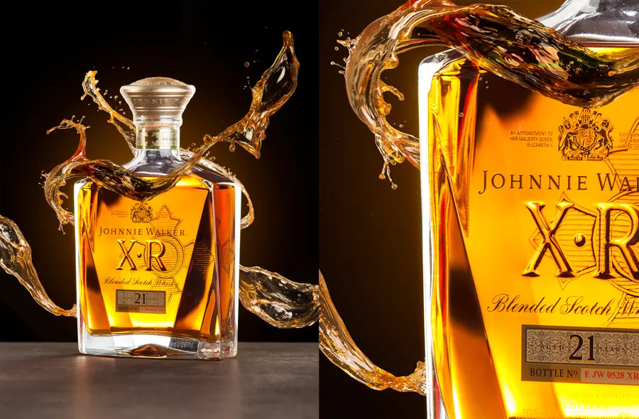 A whisky bottle with a frozen splash