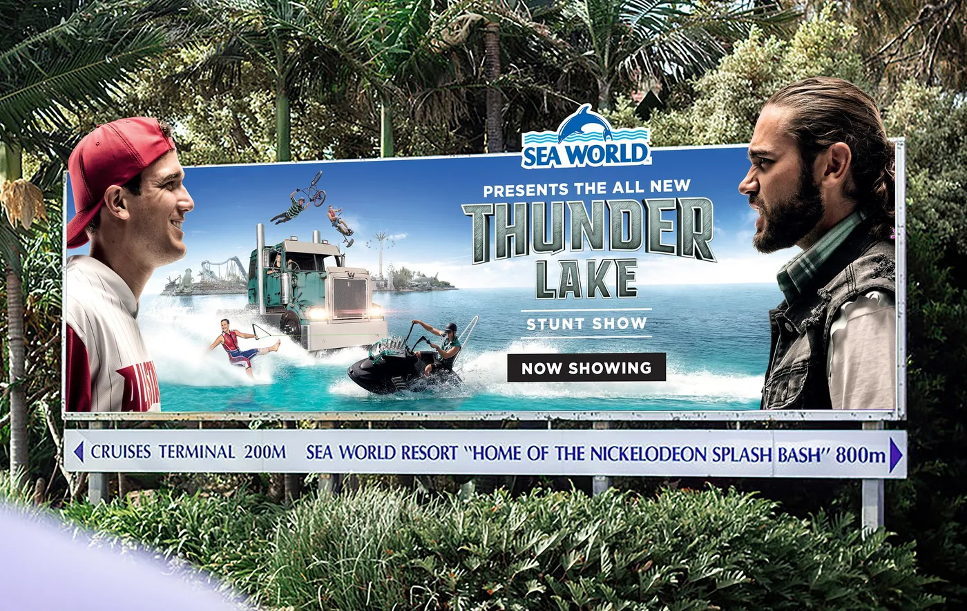Sea World roadside billboard for the Thunder Lake stunt show: a truck, jet ski and stunt riders on the water between two rival characters