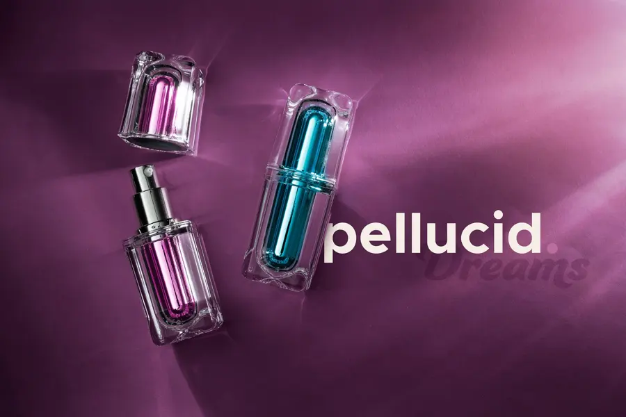 Pellucid cosmetic vials on purple silk